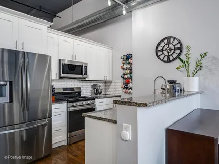 a view of a room with furniture and wooden floor