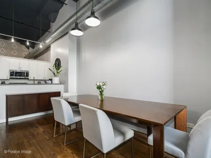a kitchen with granite countertop a refrigerator stove and microwave
