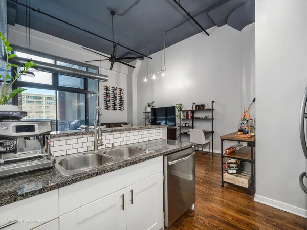 a bathroom with a sink and mirror