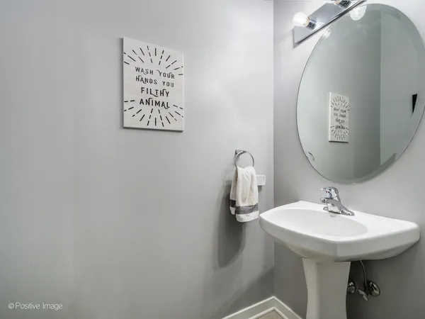 a view of a hallway with wooden floor and entryway