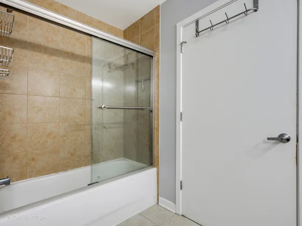 a bedroom with a bed and a book shelf