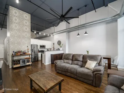 a kitchen with stainless steel appliances a stove and cabinets