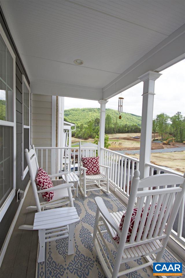 2016 Avinity Loop Charlottesville, VA 22902 - Photo 20 of 36 a view of a patio with a table chairs and a floor to ceiling window