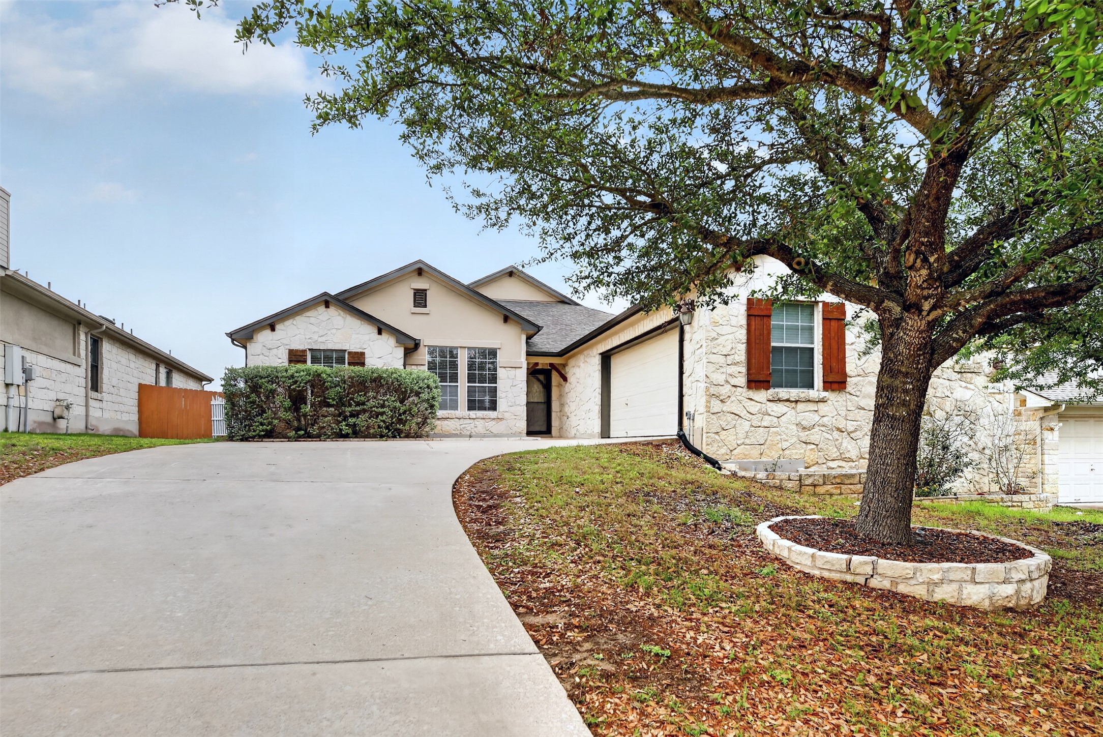 545 Manchester Lane Austin, TX 78737 - Photo 1 of 30 a front view of a house with garden