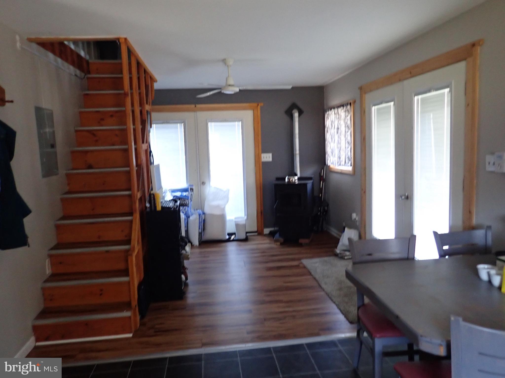 230 McKinneytown Road North East, MD 21901 - Photo 11 of 27 a view of a livingroom with wooden floor and stairs