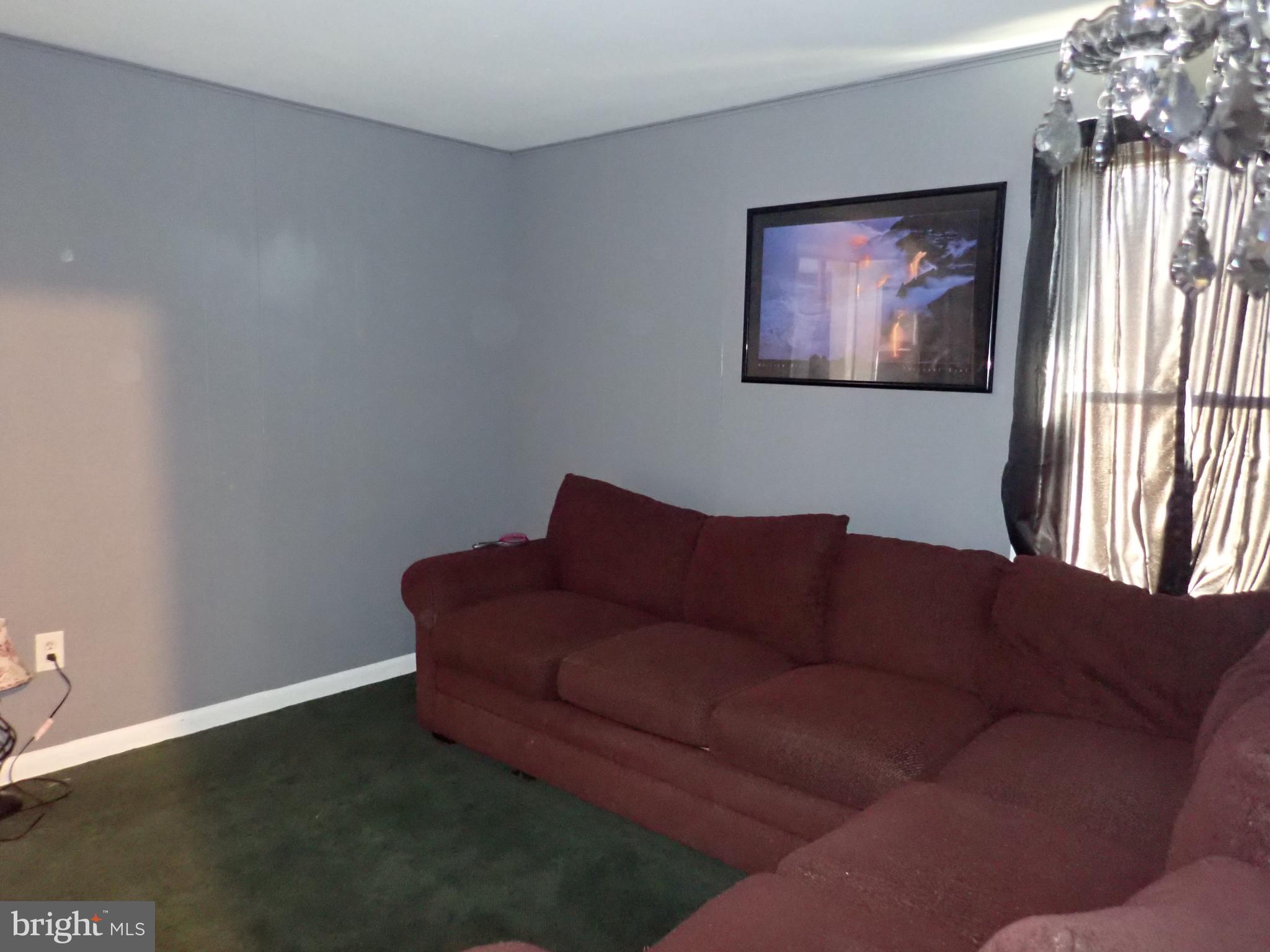 230 McKinneytown Road North East, MD 21901 - Photo 12 of 27 a living room with furniture and a flat screen tv