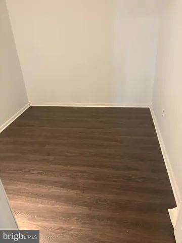 a view of room with wooden floor