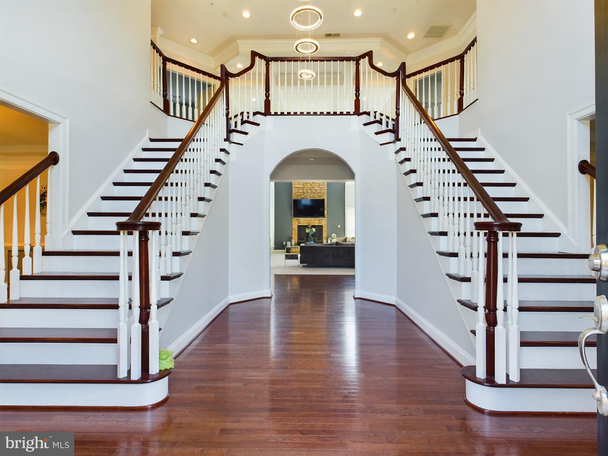 Elegant foyer with grand staircase.