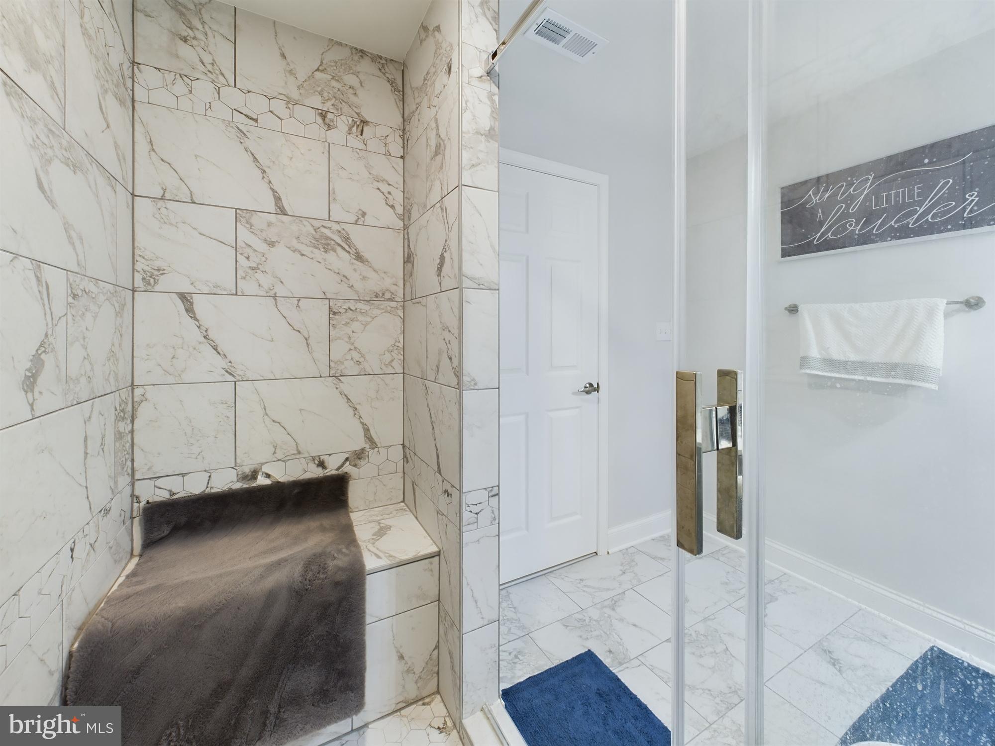 14601 Driftwood Road Bowie, MD 20721 - Photo 41 of 90 Elegant marble shower with modern accents.