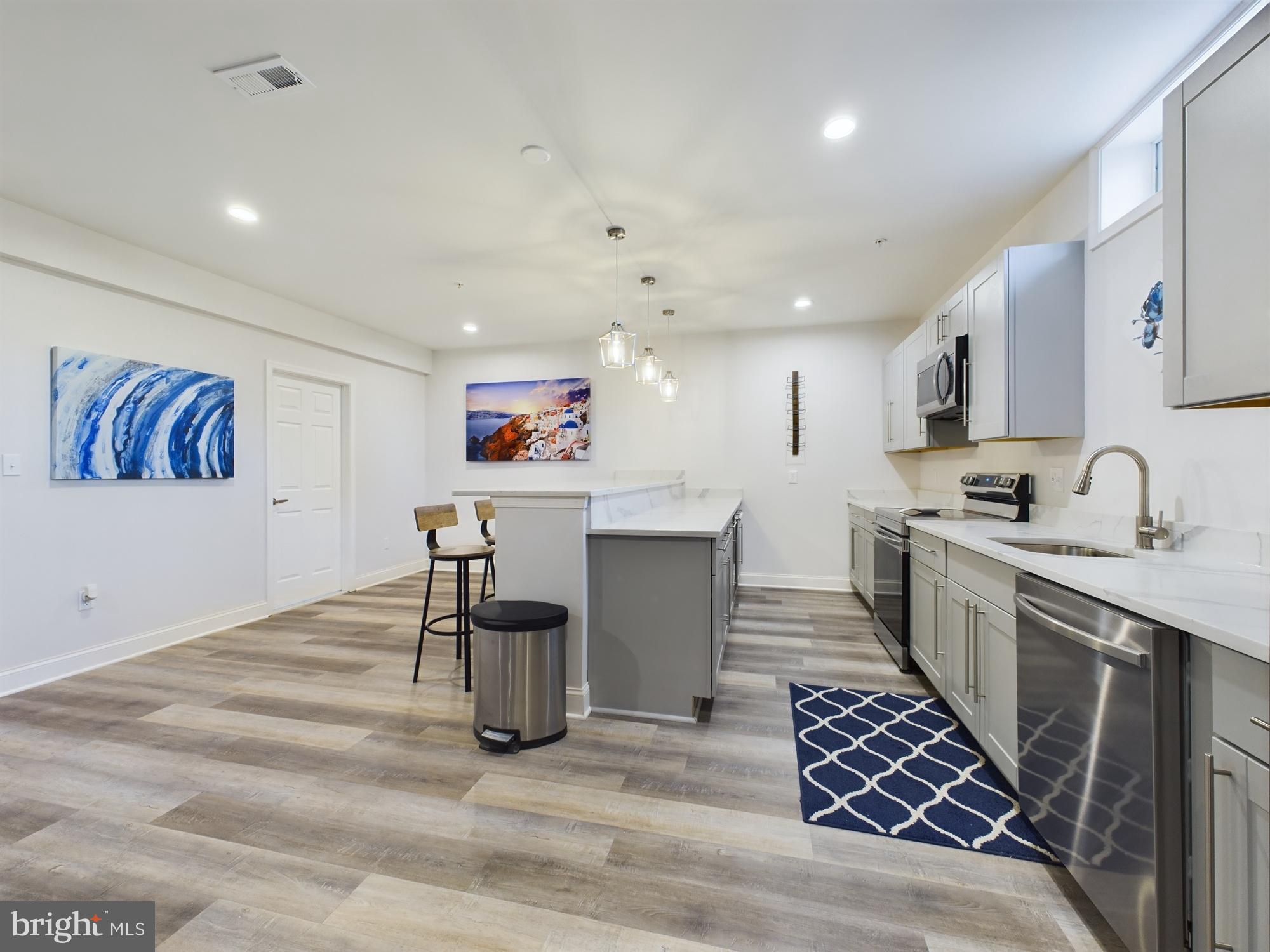 14601 Driftwood Road Bowie, MD 20721 - Photo 44 of 90 Modern kitchen with sleek finishes and art.