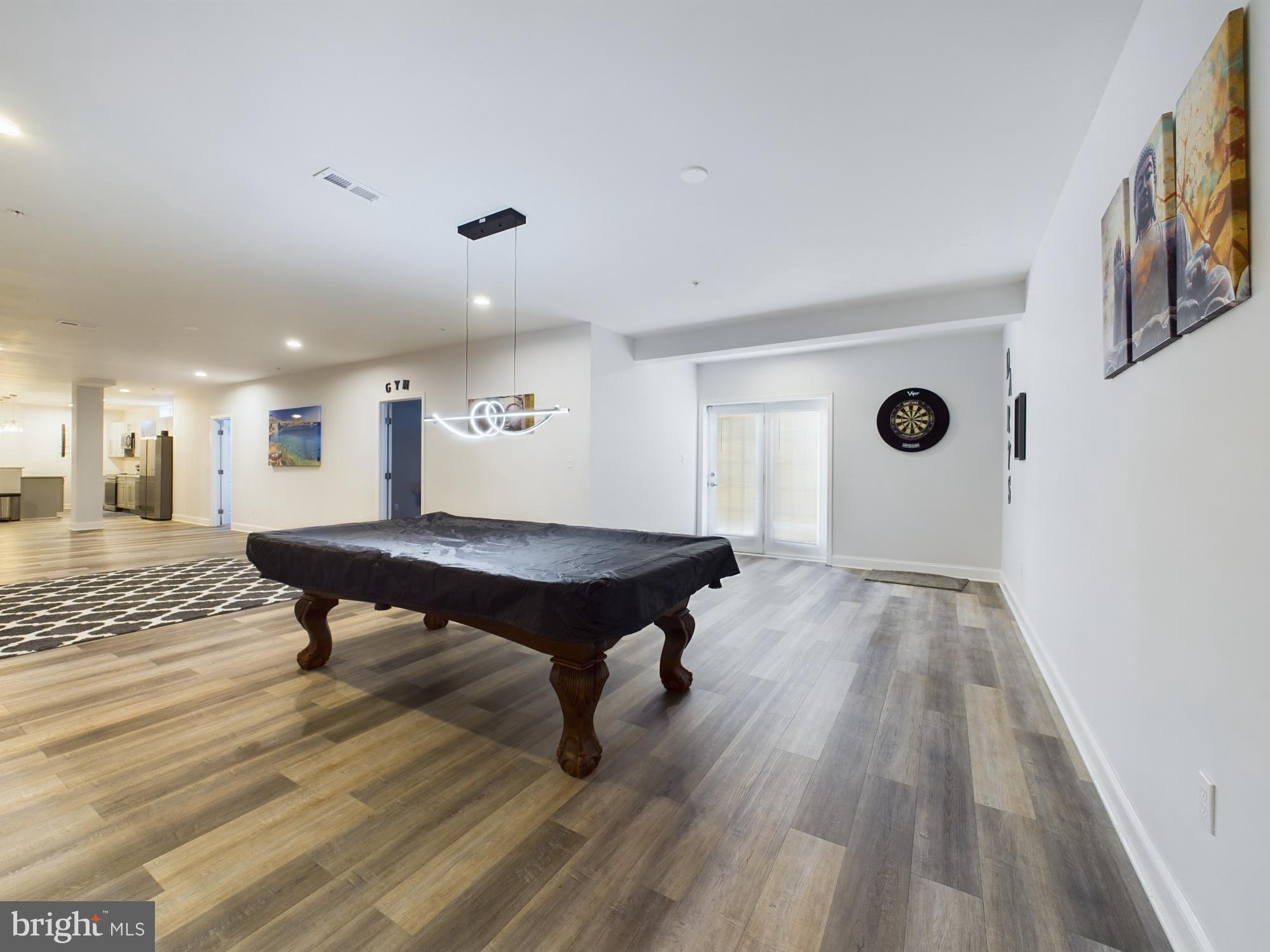 14601 Driftwood Road Bowie, MD 20721 - Photo 60 of 90 Spacious game room with modern elegance.
