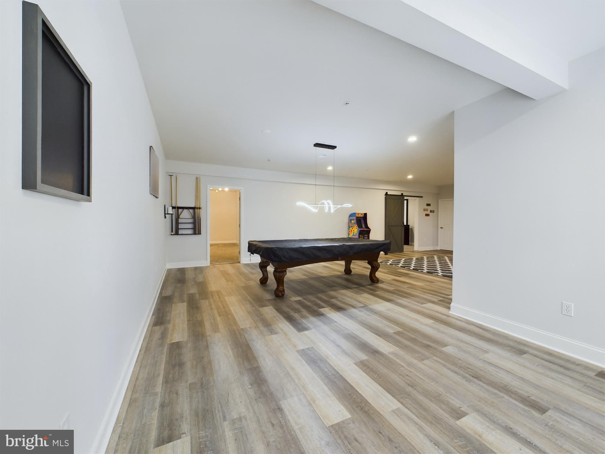 14601 Driftwood Road Bowie, MD 20721 - Photo 61 of 90 Spacious, modern game room with sleek design.