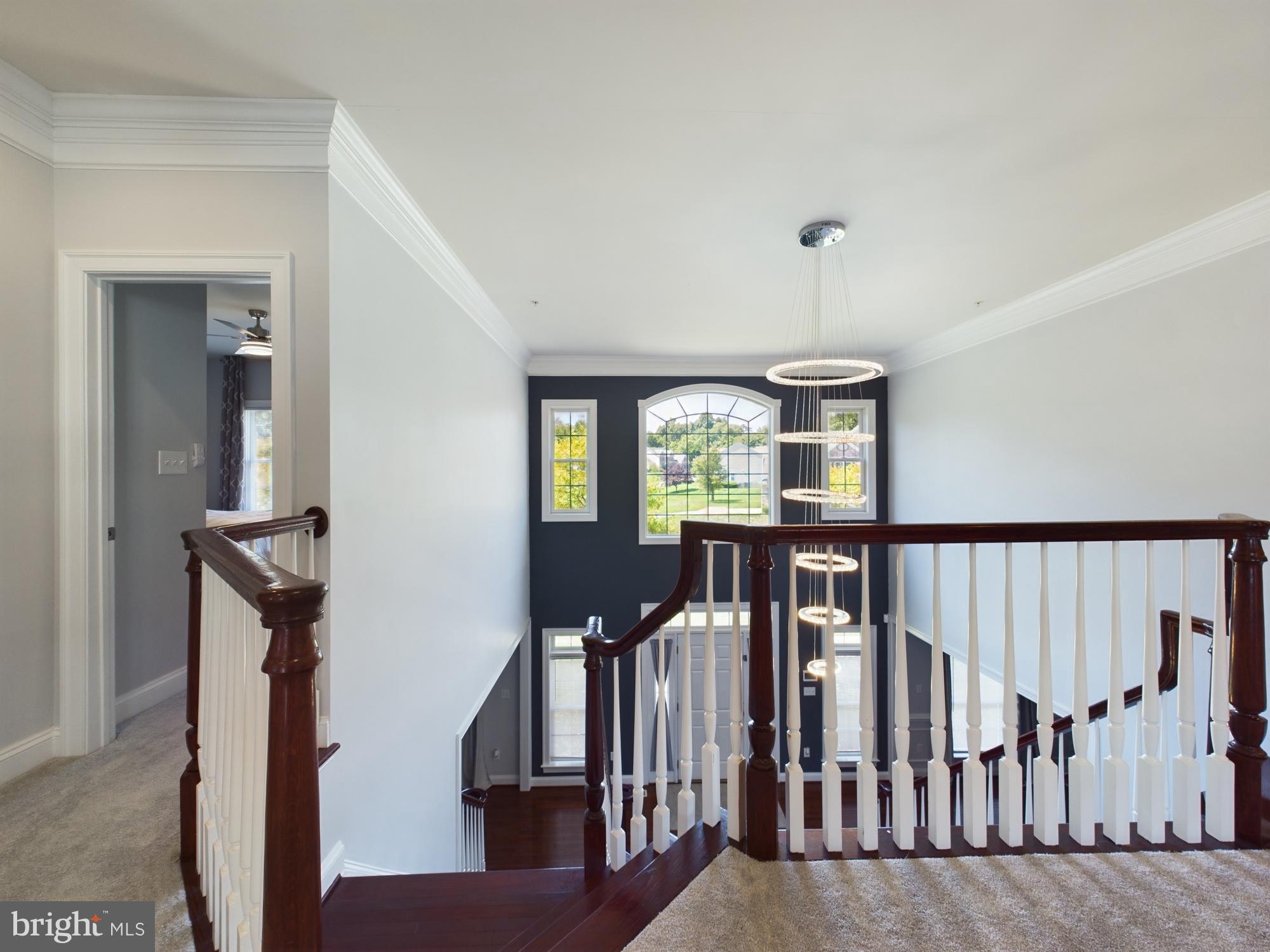 14601 Driftwood Road Bowie, MD 20721 - Photo 64 of 90 Elegant staircase with modern lighting.