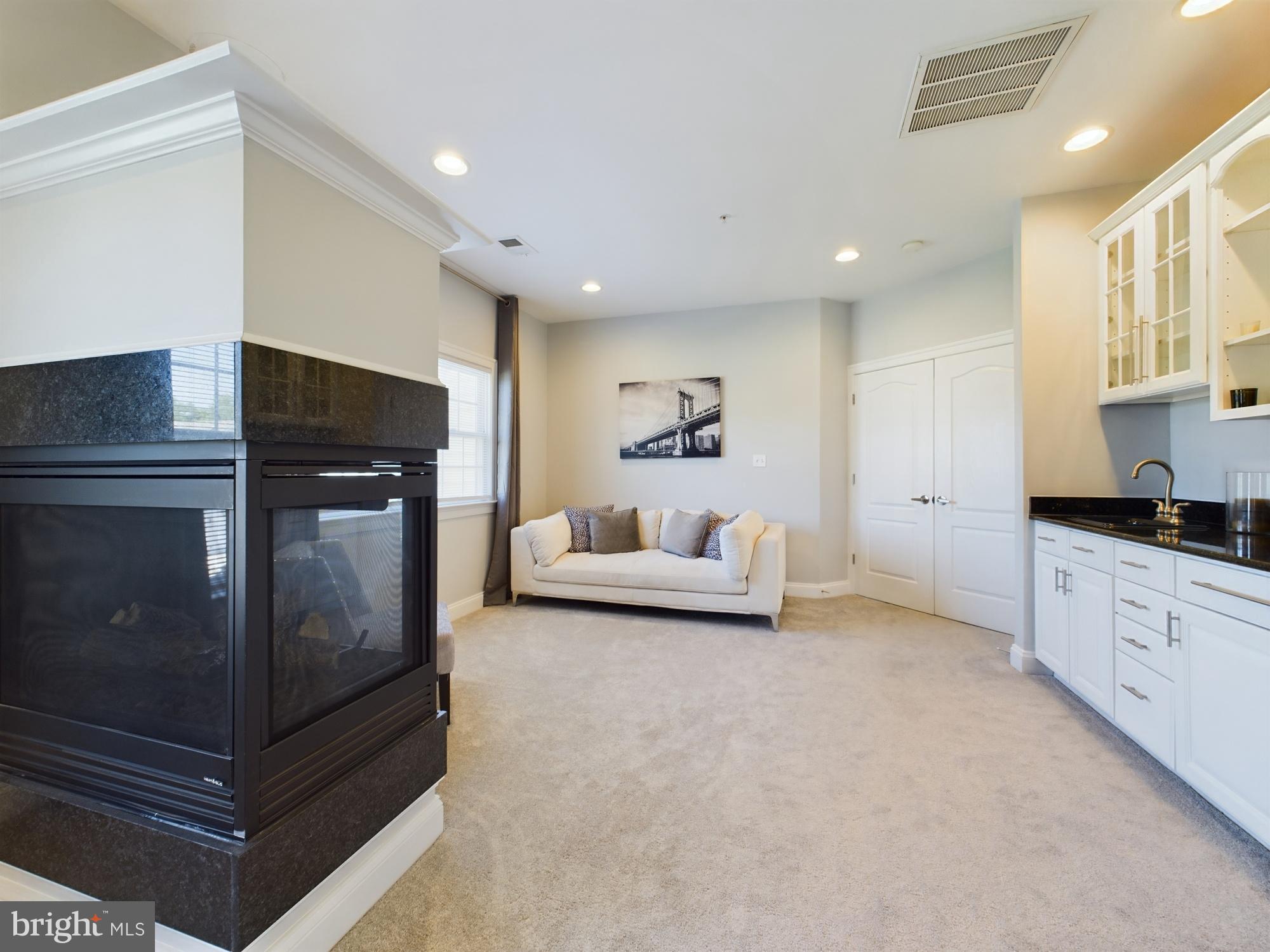 14601 Driftwood Road Bowie, MD 20721 - Photo 80 of 90 Modern elegance with cozy fireplace charm.