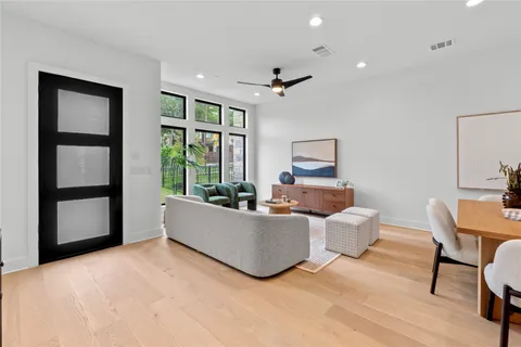 a bedroom with a bed lamps and window