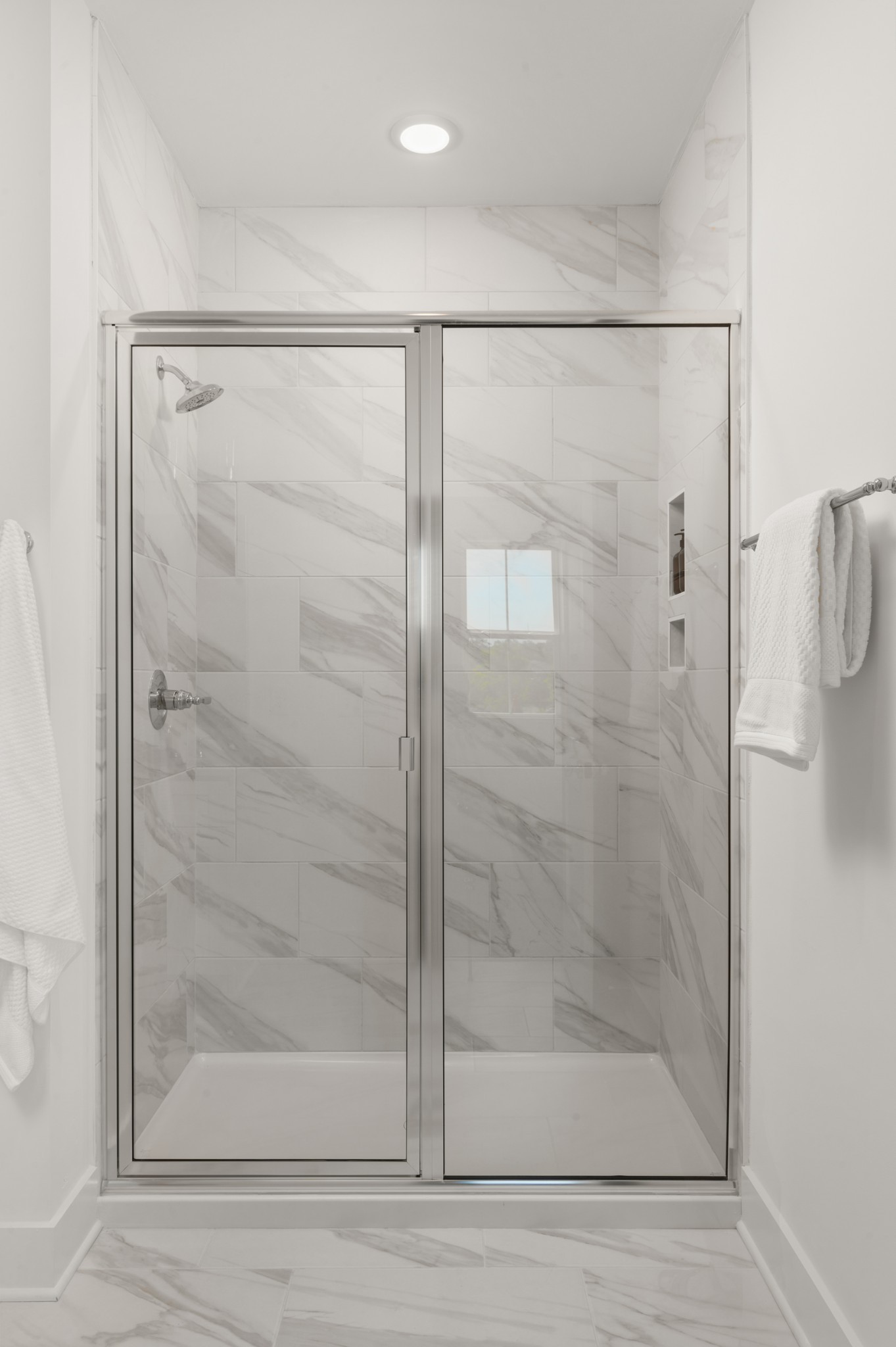 116 Chadwick Court Madison, TN 37115 - Photo 11 of 23 a bathroom with a glass shower door