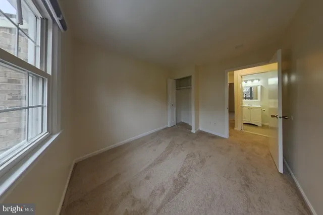 a bathroom with a granite countertop sink mirror toilet and bathtub