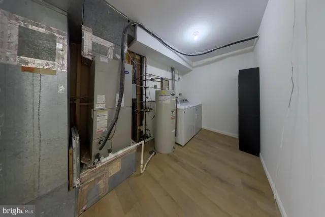 wooden floor in an empty room with a fireplace