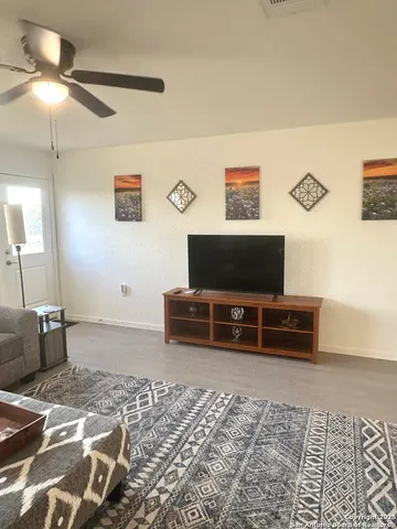 a hotel room with a bed and a flat screen tv