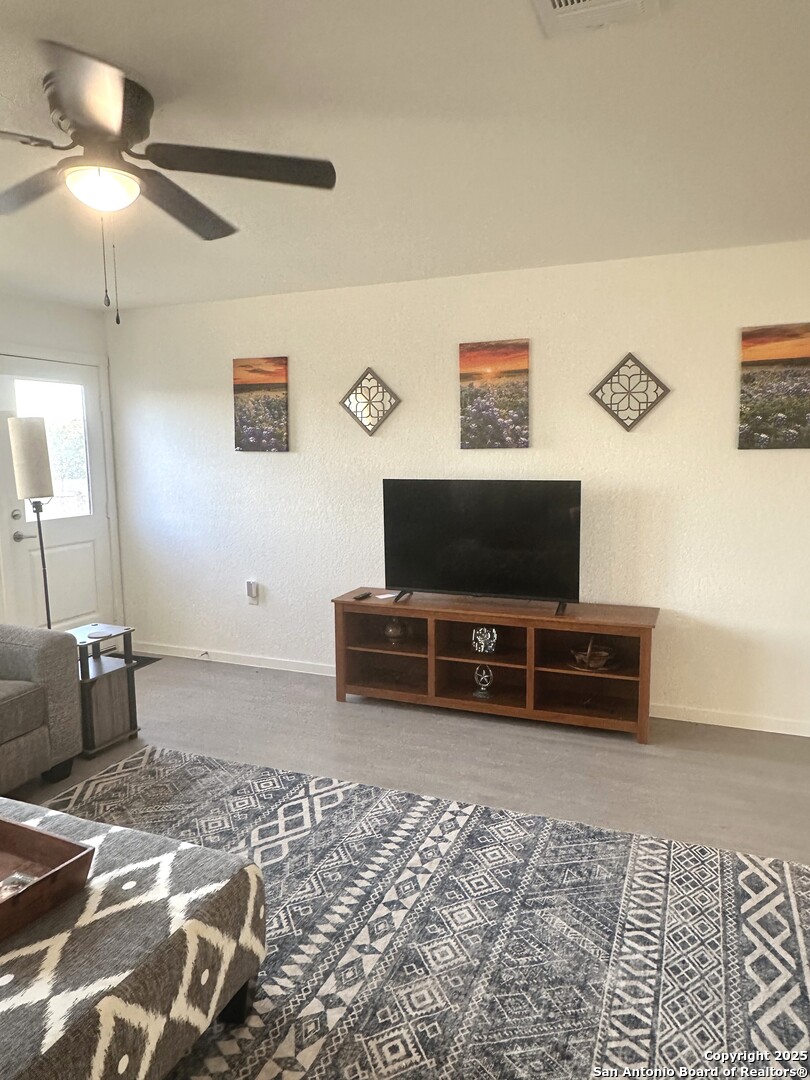 515 Lew Pass San Antonio, TX 78221 - Photo 16 of 26 a hotel room with a bed and a flat screen tv
