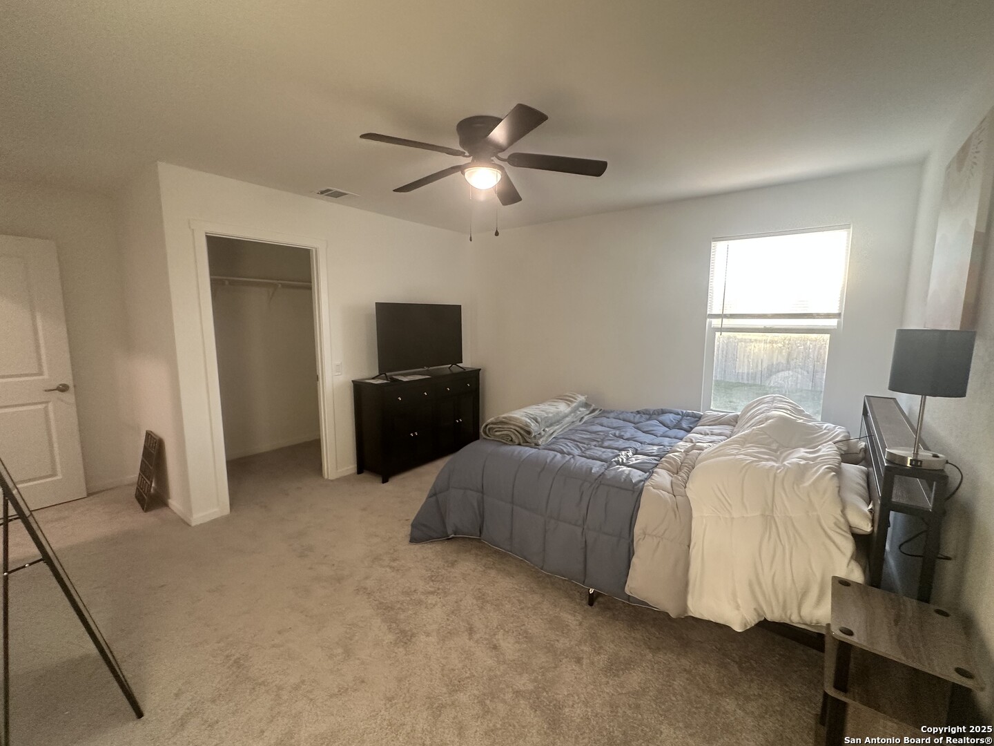 515 Lew Pass San Antonio, TX 78221 - Photo 18 of 26 a bedroom with a bed and a television