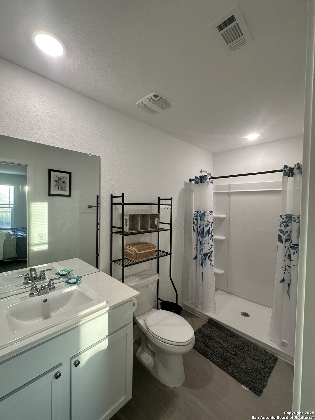 515 Lew Pass San Antonio, TX 78221 - Photo 20 of 26 a bathroom with a sink toilet and shower