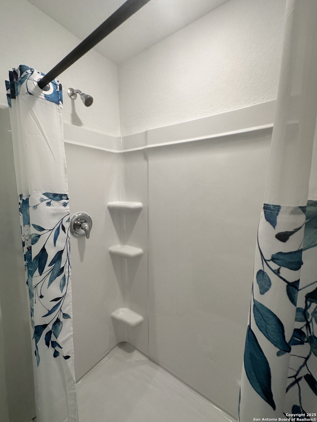 515 Lew Pass San Antonio, TX 78221 - Photo 21 of 26 a bathroom with a toilet and a shower curtain
