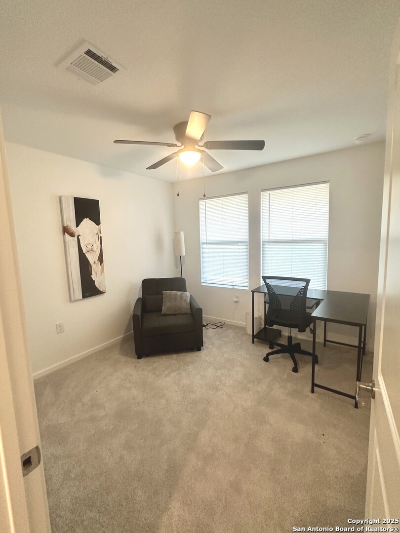 515 Lew Pass San Antonio, TX 78221 - Photo 4 of 26 a living room with furniture and a window