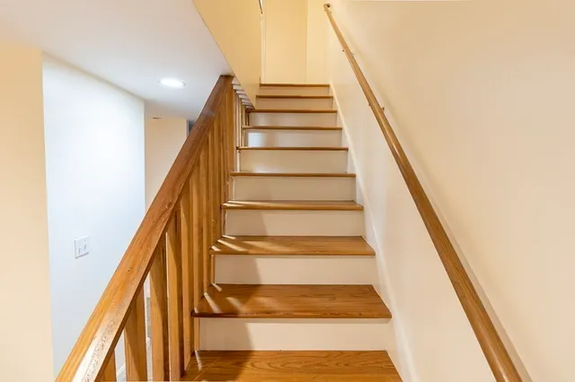 a view of kitchen with refrigerator and microwave