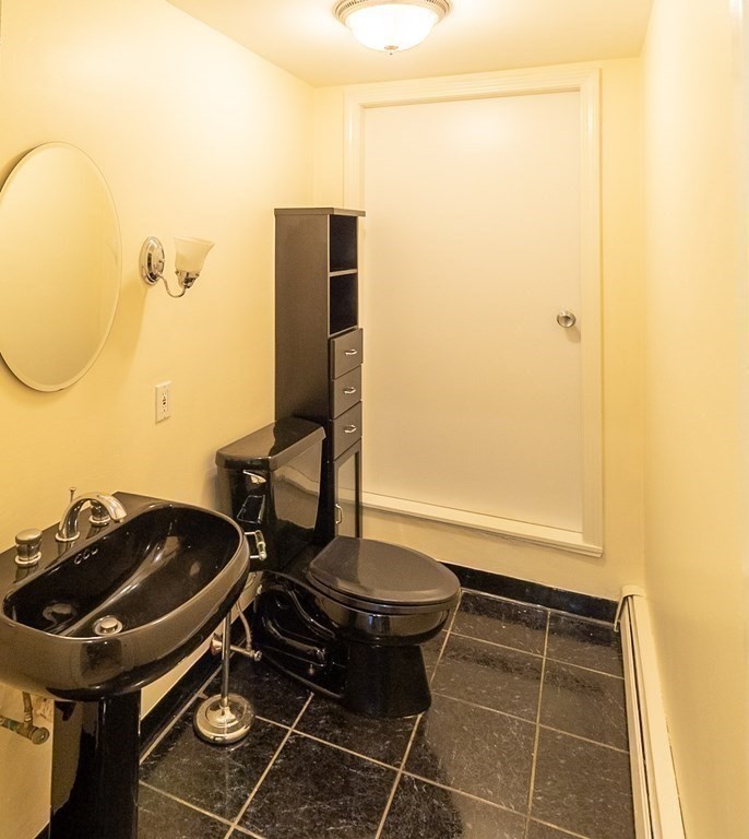 55 East Concord Street, Unit 1 Boston, MA 02118 - Photo 16 of 16 a bathroom with a sink and a mirror