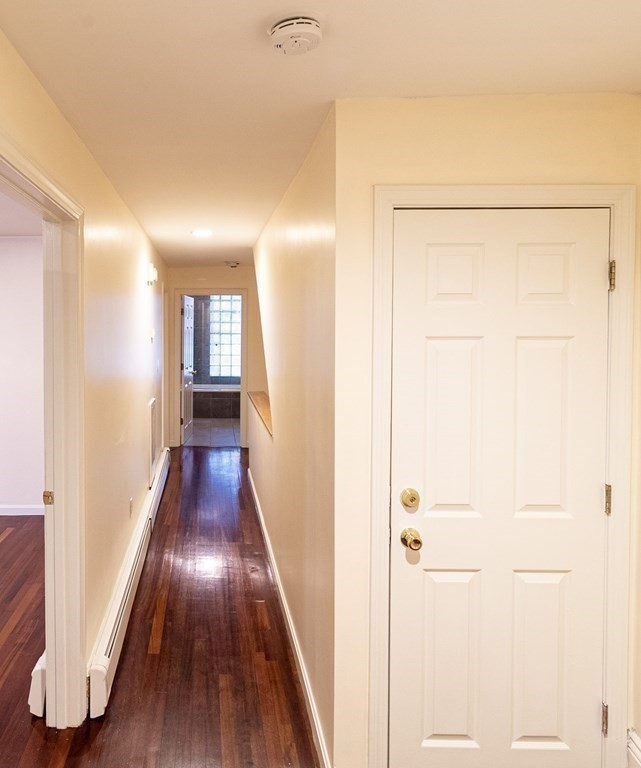 55 East Concord Street, Unit 1 Boston, MA 02118 - Photo 4 of 16 a view of hallway with wooden floor
