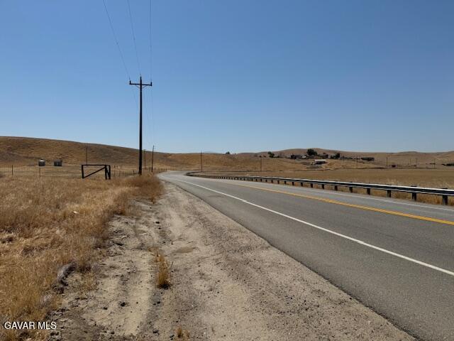 Round Mountain Road Bakersfield, CA 93308 - Photo 7 of 31 a view of an empty room with wooden floor