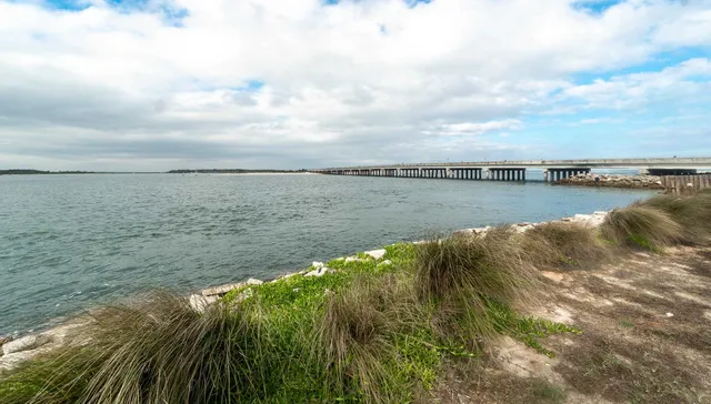 a view of living room with furniture and floor to ceiling window