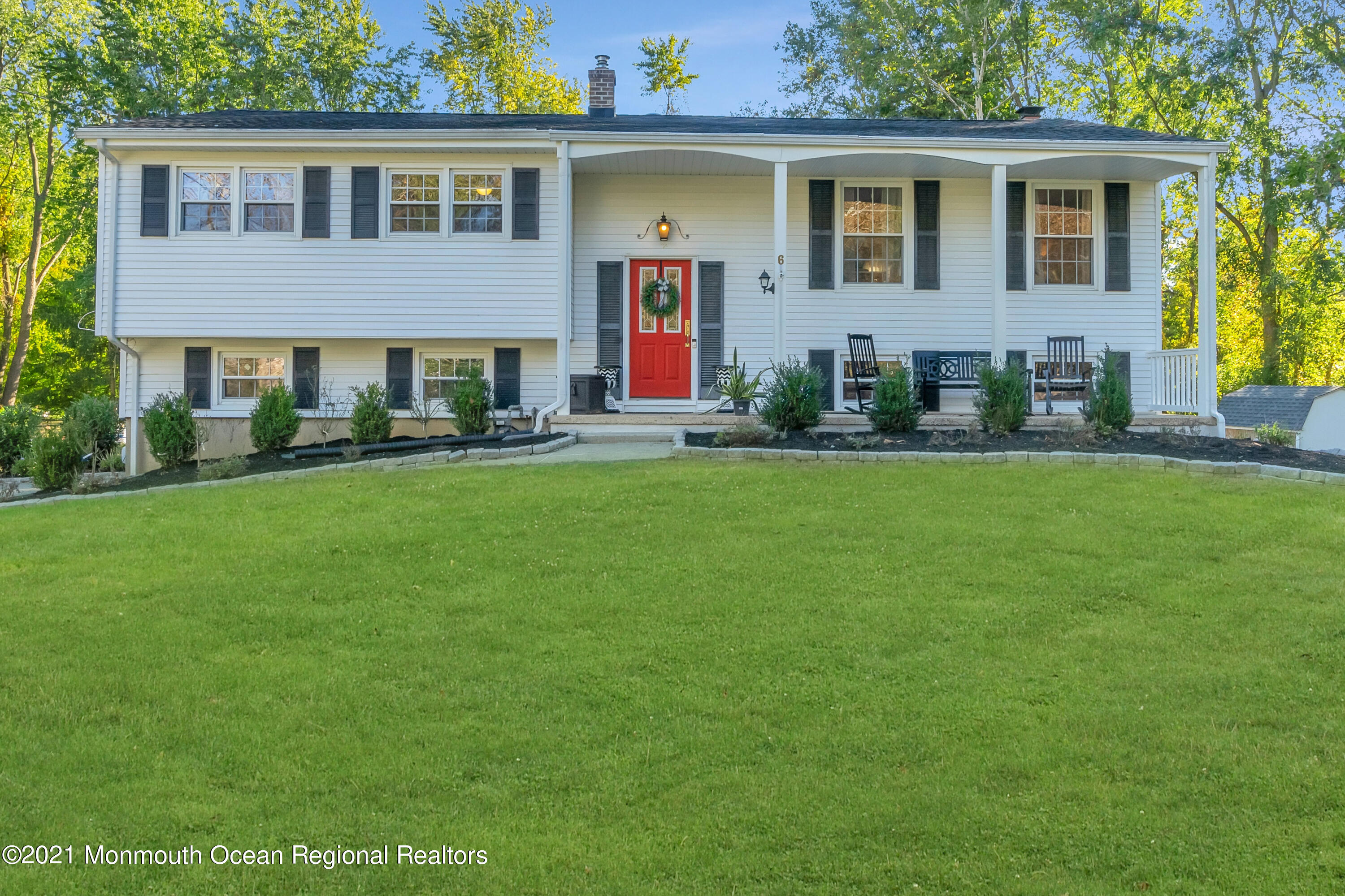 6 Spring Valley Drive Holmdel, NJ 07733 - Photo 1 of 32 a front view of house with yard and green space
