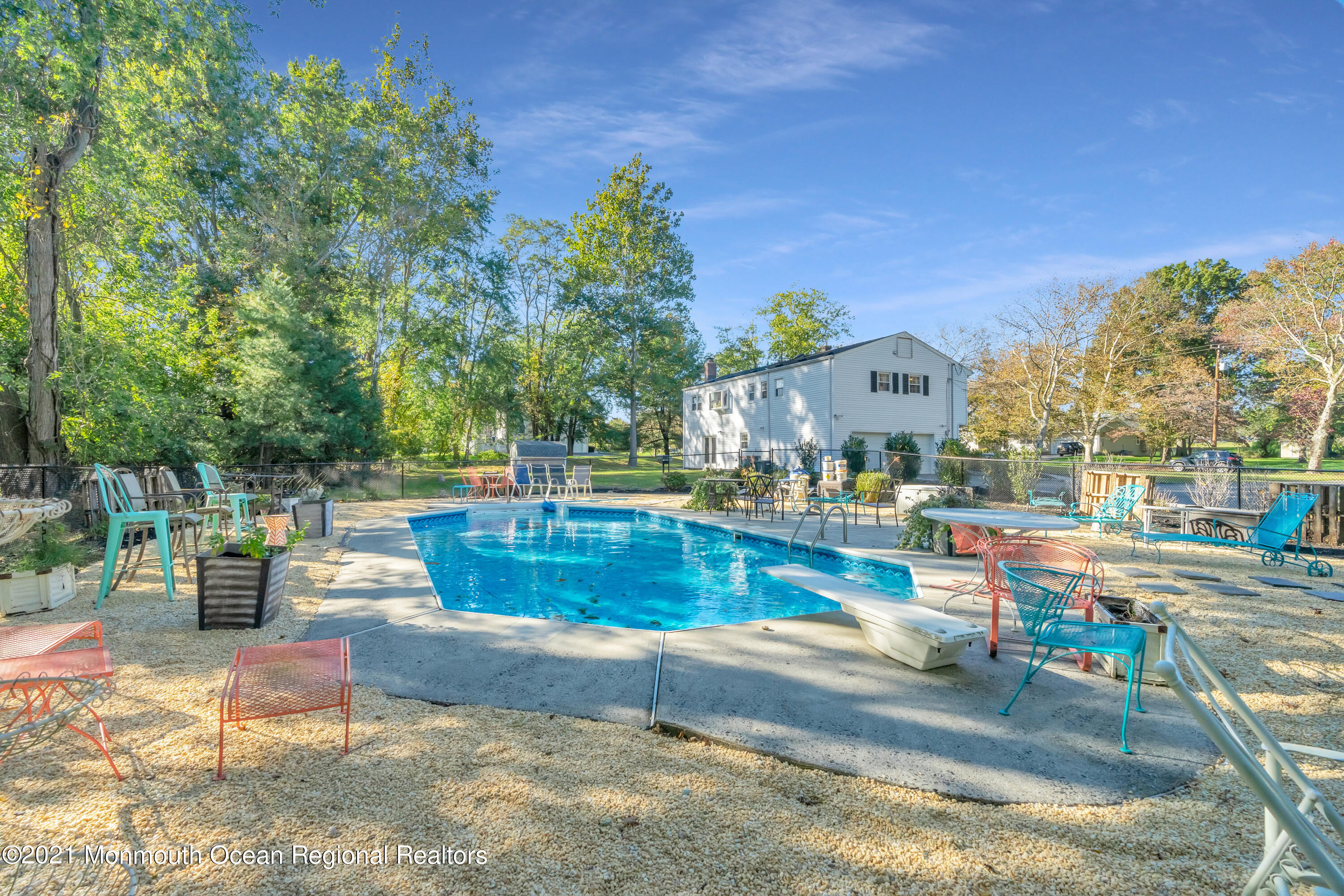 6 Spring Valley Drive Holmdel, NJ 07733 - Photo 2 of 32 a view of swimming pool with outdoor seating and plants