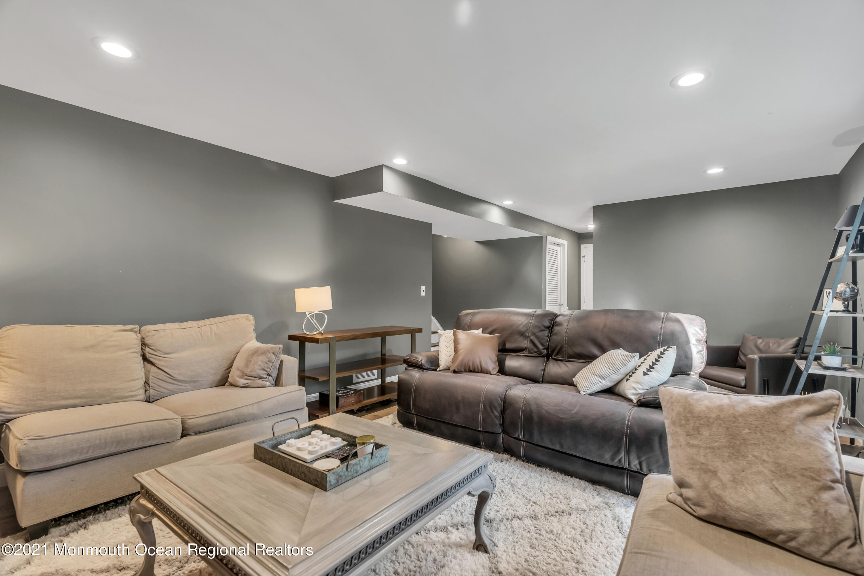 6 Spring Valley Drive Holmdel, NJ 07733 - Photo 15 of 32 a living room with furniture and a couch