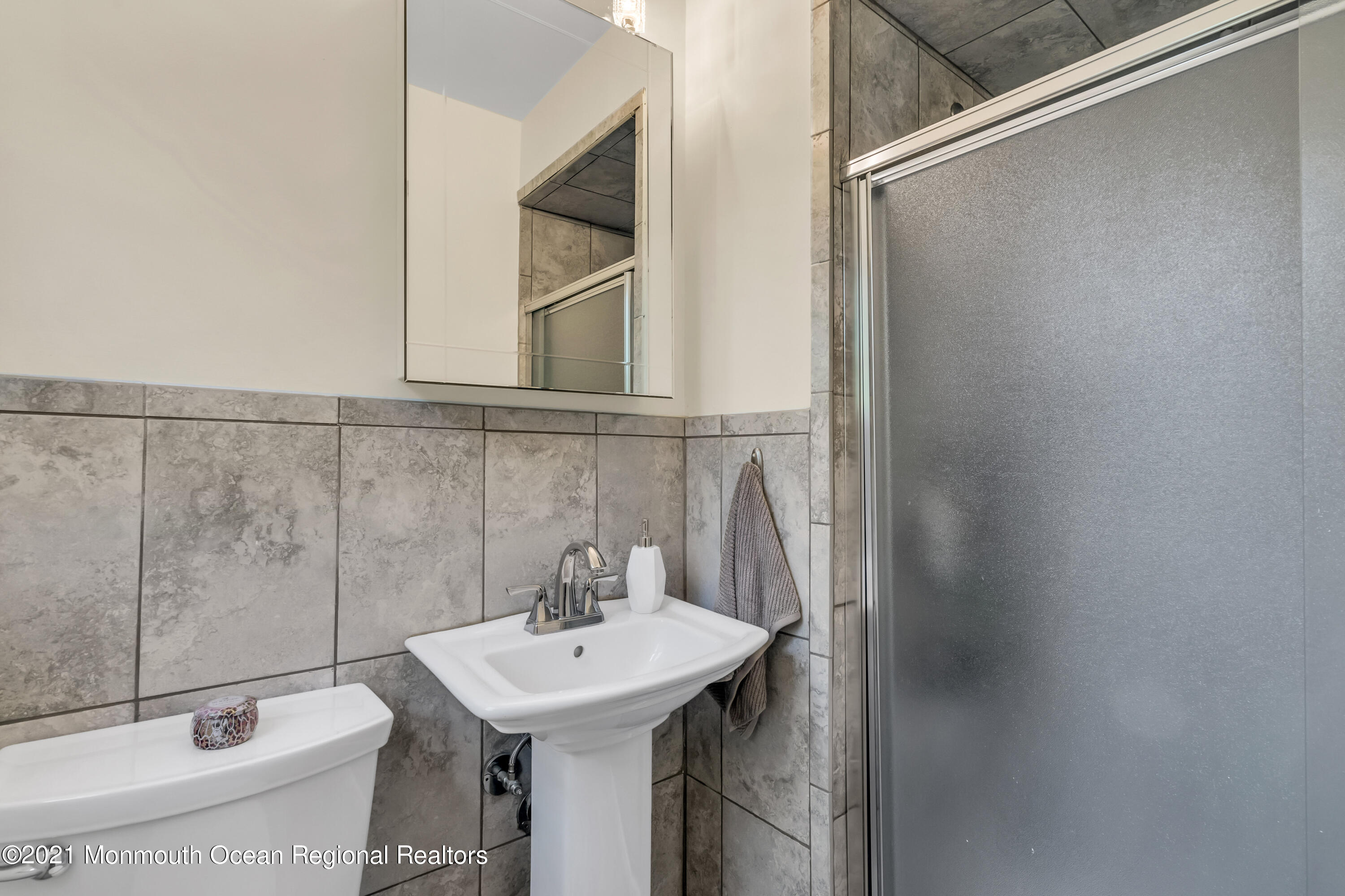 6 Spring Valley Drive Holmdel, NJ 07733 - Photo 17 of 32 a bathroom with a sink toilet and shower