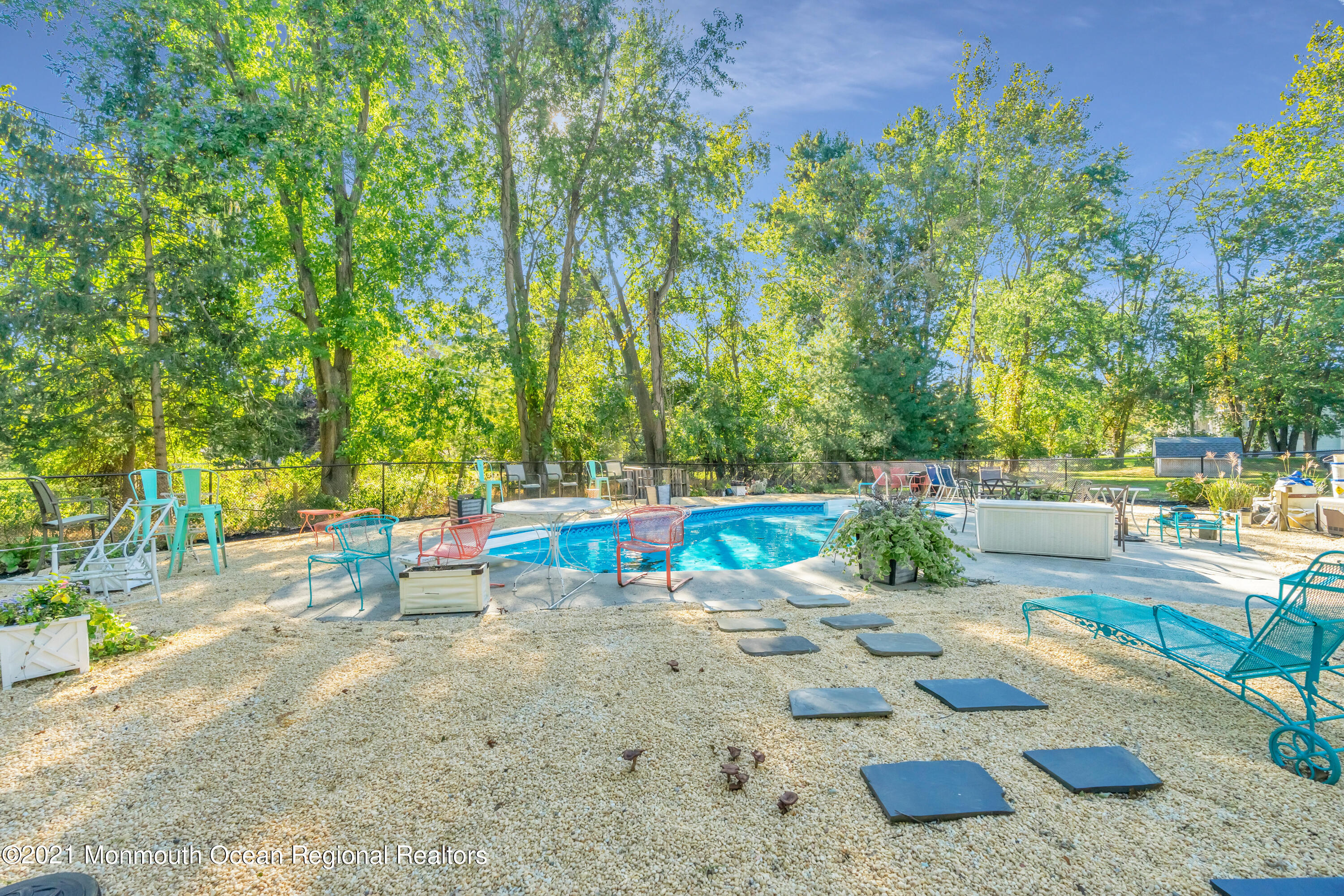6 Spring Valley Drive Holmdel, NJ 07733 - Photo 3 of 32 a view of a backyard with swimming pool