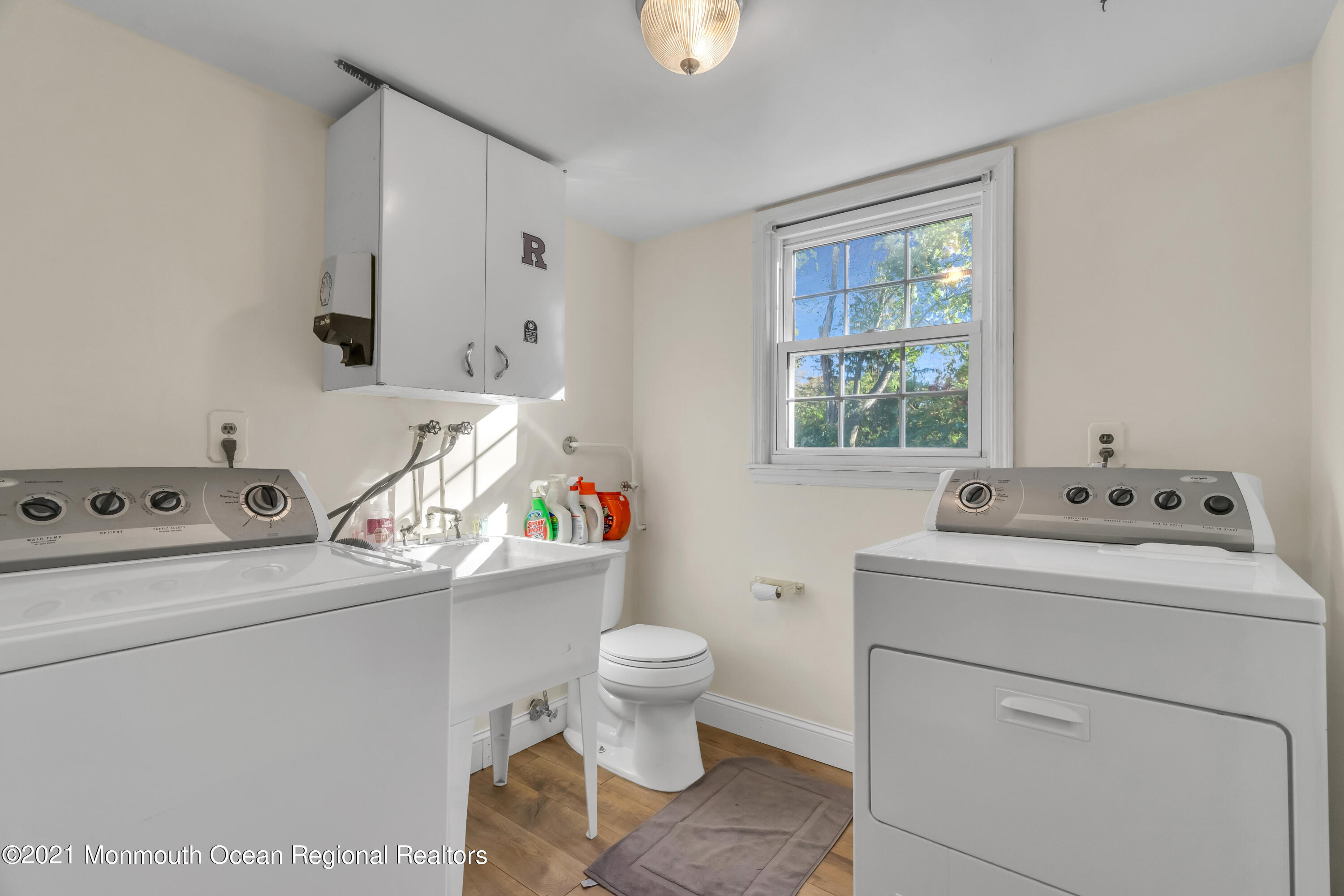 6 Spring Valley Drive Holmdel, NJ 07733 - Photo 23 of 32 a bathroom with a sink toilet and a window