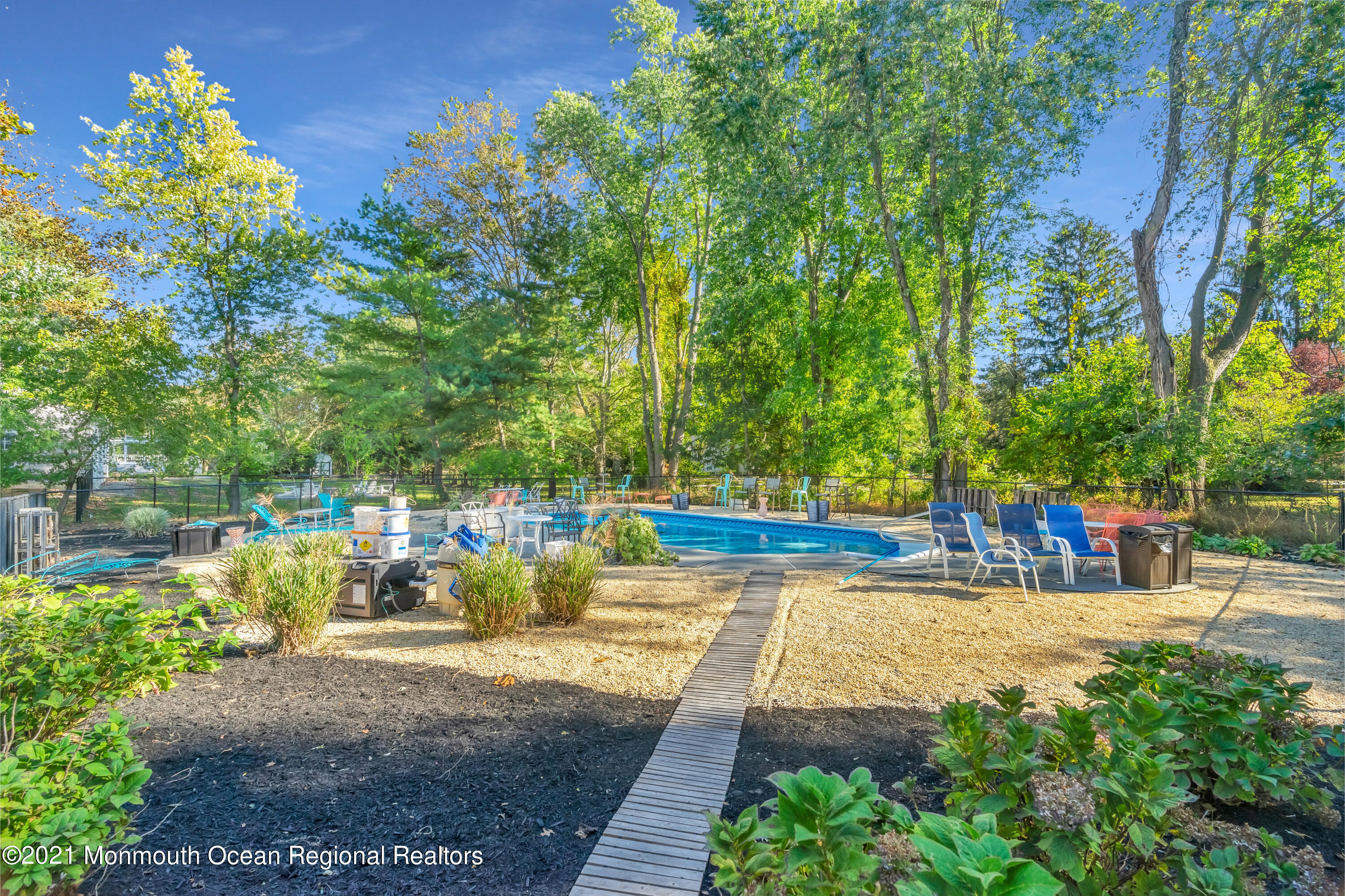 6 Spring Valley Drive Holmdel, NJ 07733 - Photo 24 of 32 a view of a swimming pool with a patio