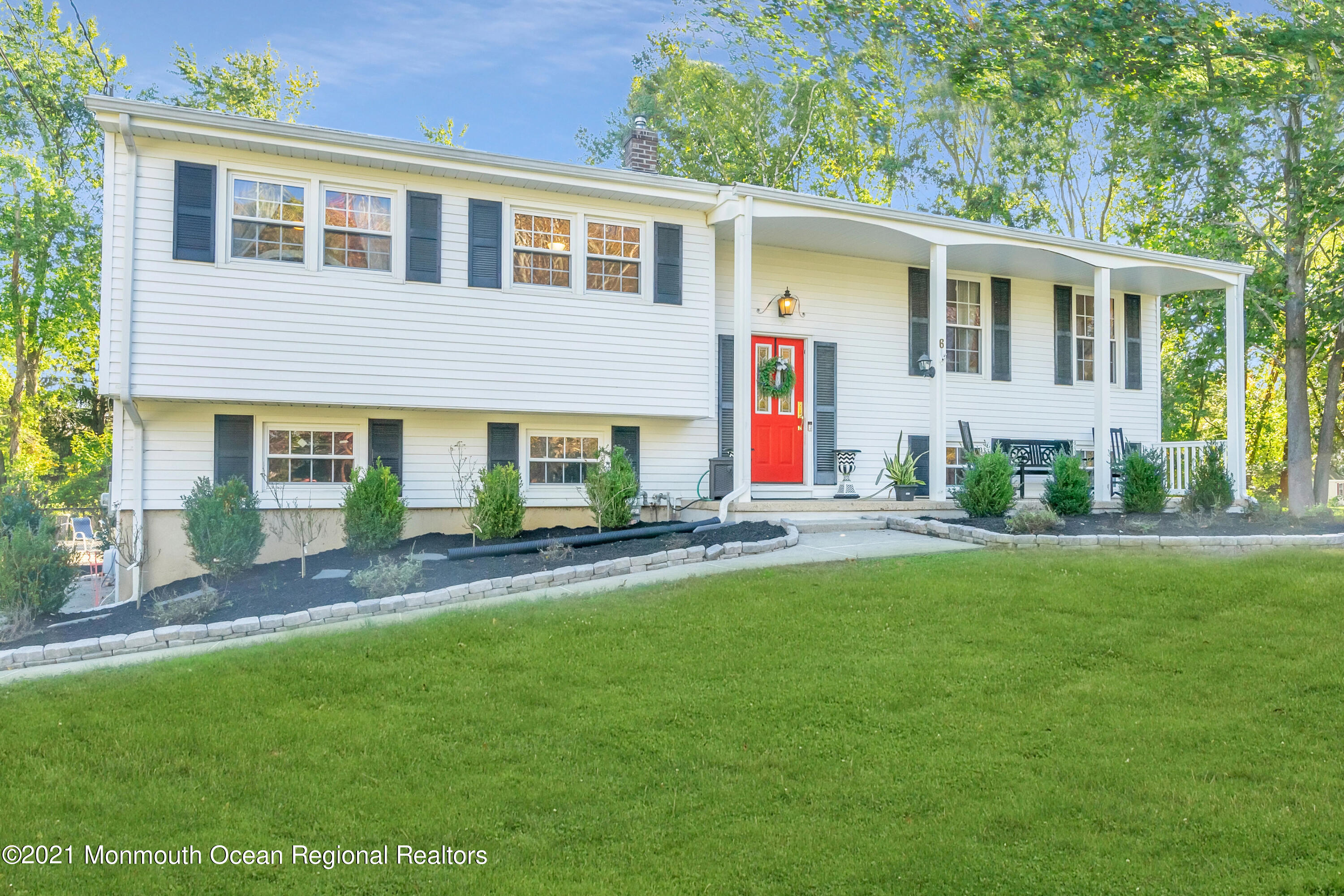 6 Spring Valley Drive Holmdel, NJ 07733 - Photo 29 of 32 a view of a house with a yard and sitting area