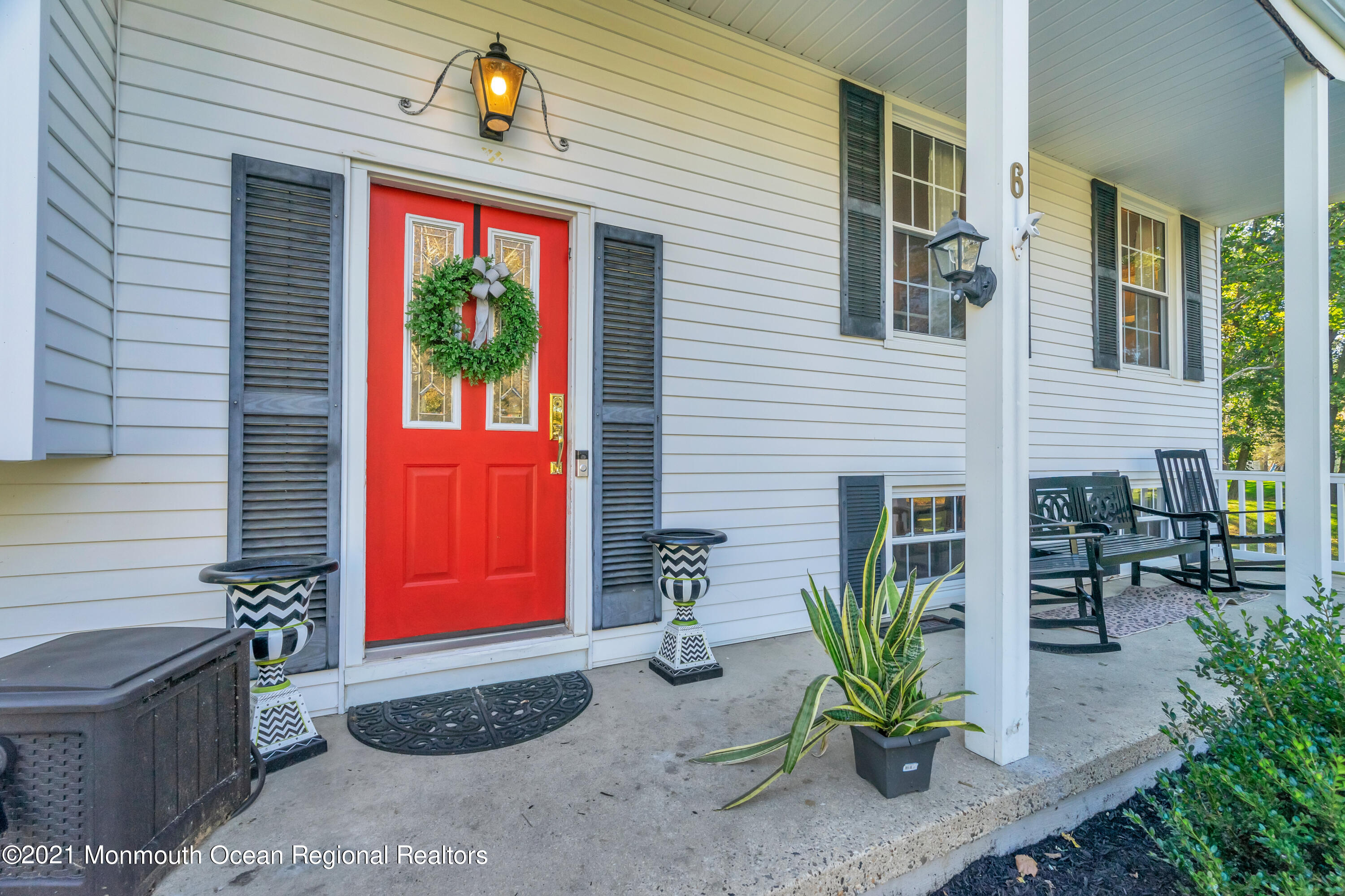6 Spring Valley Drive Holmdel, NJ 07733 - Photo 4 of 32 a view of front door of house with outdoor seating