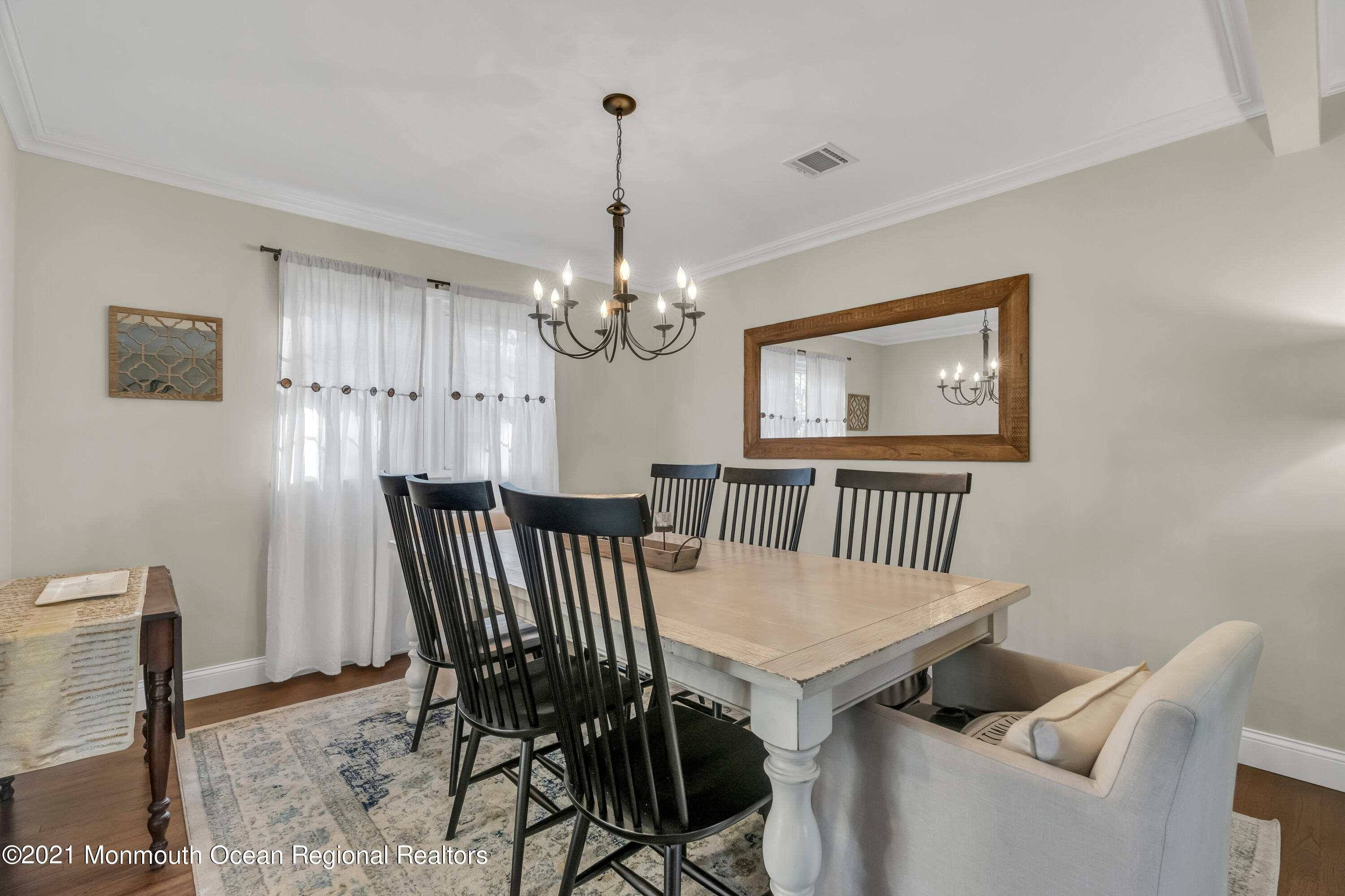 6 Spring Valley Drive Holmdel, NJ 07733 - Photo 8 of 32 a view of a dining room with furniture and a chandelier