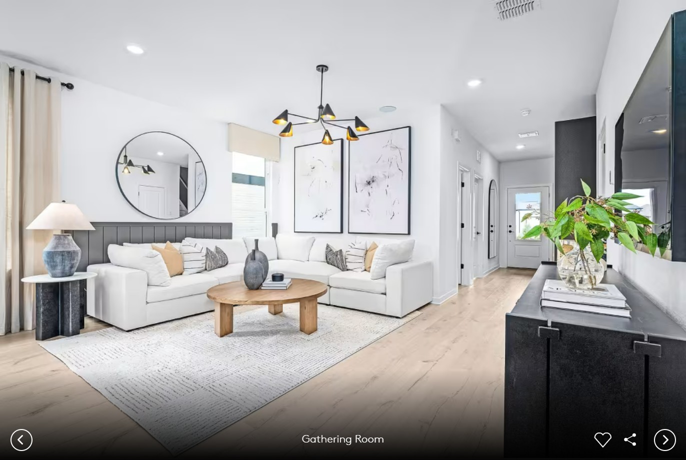 624 Rubber Tree Way Buda, TX 78610 - Photo 9 of 12 a living room with furniture and a chandelier