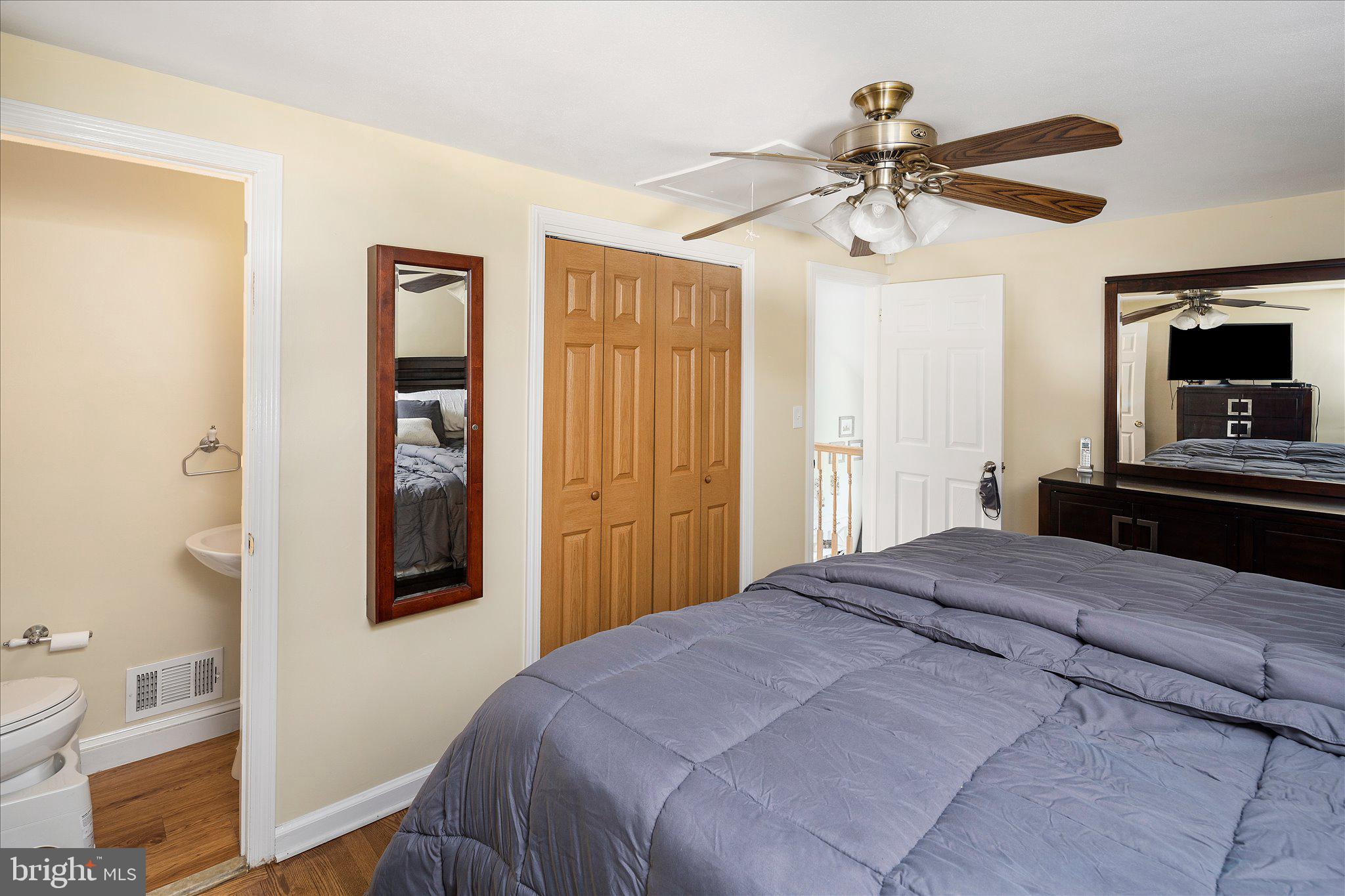 3 Heights Terrace Hamilton, NJ 08620 - Photo 12 of 30 a bedroom with a bed and a chandelier