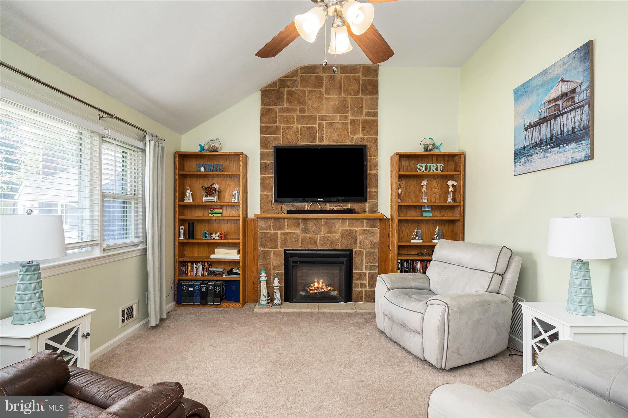 3 Heights Terrace Hamilton, NJ 08620 - Photo 4 of 30 a living room with furniture a fireplace and a flat screen tv