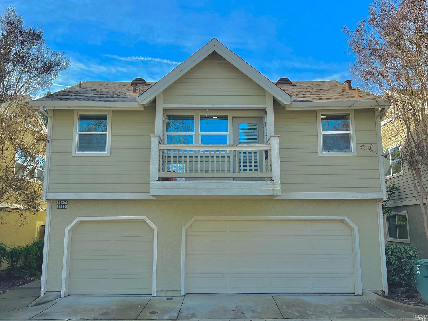 a front view of a house with a garage