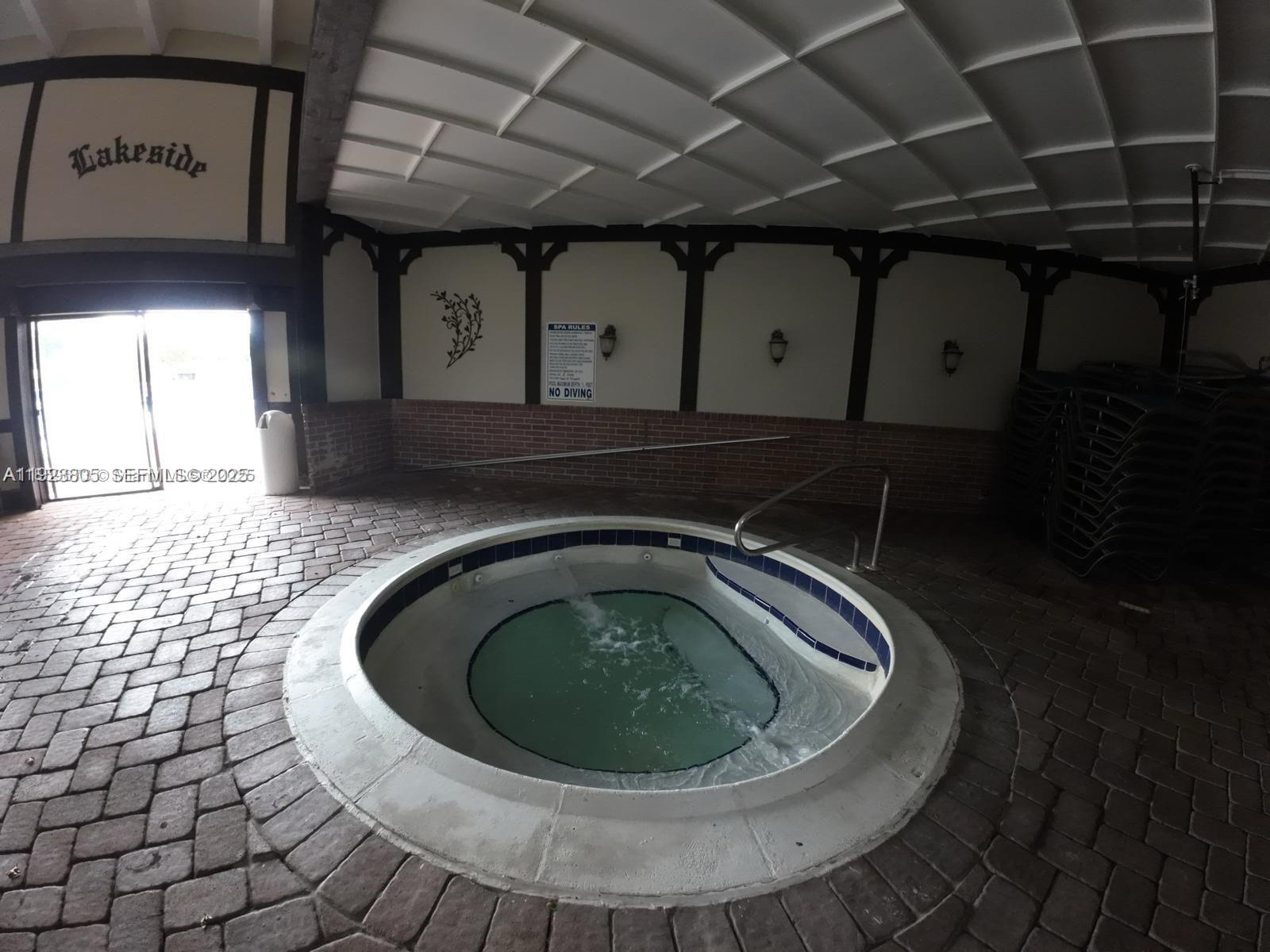 3720 Inverrary Drive, Unit 1S Lauderhill, FL 33319 - Photo 12 of 25 a utility room with a sink