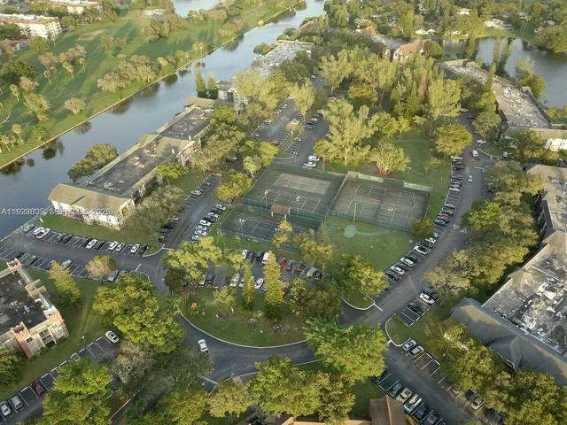 a view of a car park in front of house