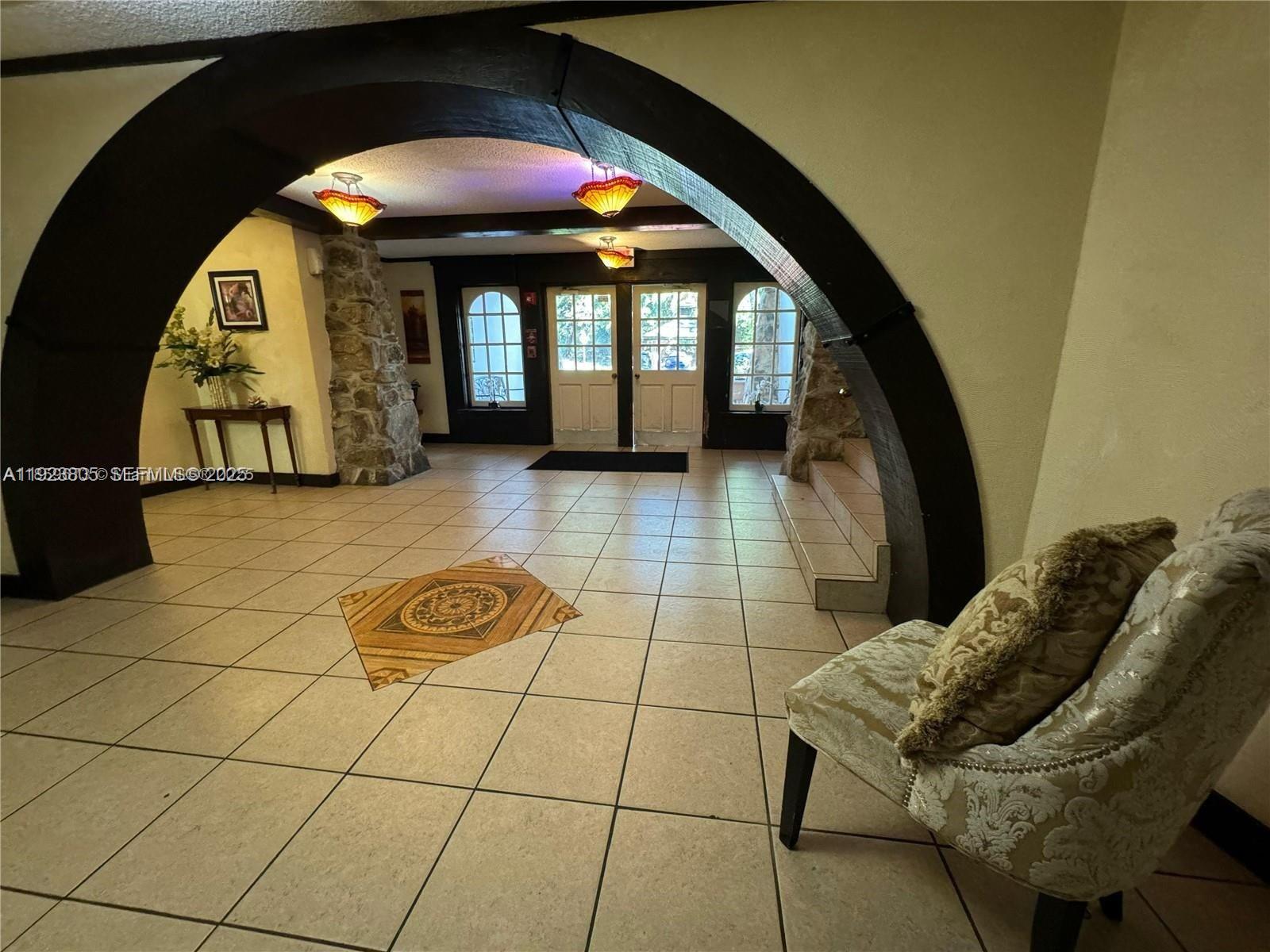 3720 Inverrary Drive, Unit 1S Lauderhill, FL 33319 - Photo 21 of 25 a view of entryway with a couch